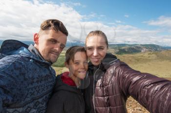 Selfie of family in mountain, beauty summer landcape