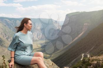 Woman on the top of Altai mountain, Katu Yaryk mountain pass and the valley of the river of Chulyshman, beauty summer day landcape. Travel, leisure and freedom concept