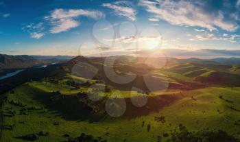 Aerial Panorama drone shot of beauty dawn on the peak, in the mountains in Altay, summertime