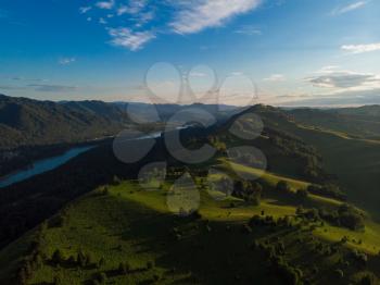 Aerial drone shot of beauty dawn on the peak, in the mountains in Altay, summertime