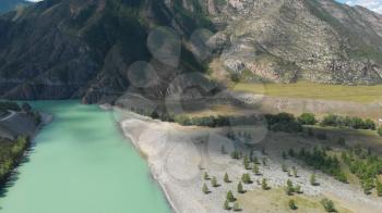 The confluence of two rivers, Katun and Chuya, the famous tourist spot in the Altai mountains, Siberia, Russia, aerial 4k footage.