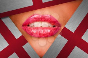 Beautiful female lips closeup behind england background