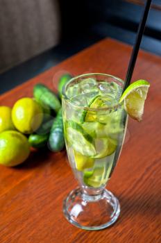 cold fresh lemonade drink with cucumber and lime