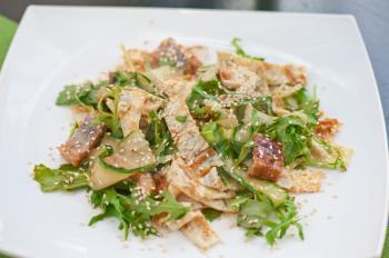 Salad with smoked eel. Japanese food