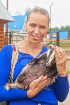 Young attractive woman with badger