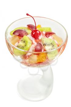 Fruit salad with ice cream in plate on white