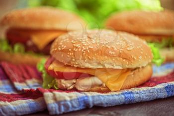 Closeup of home made burgers on wooden table