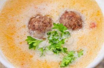 Cheese soup with meat balls and vegetables