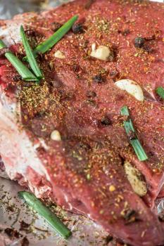 Raw beef meat seasoned and ready to cooked