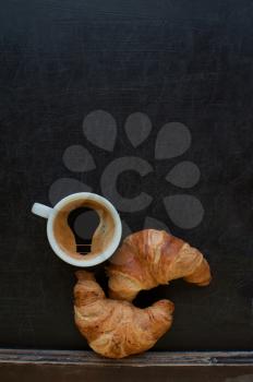 idea coffee with croissant at board