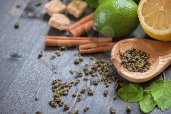 tea composition with cinnamon sticks, lemons