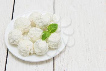Homemade coconut candies with filling of cream and nut