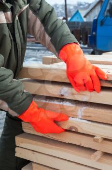 Carpenter working at sawmill, closeup photo