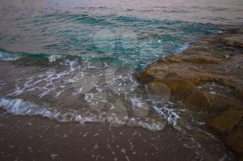 Blue sea with waves in the evening
