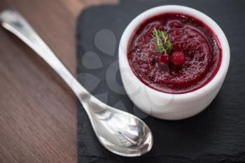 Refreshing cranberry sorbet at white bowl