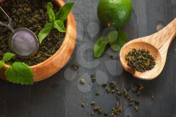 tea composition with cinnamon sticks, lemons