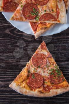 Pepperoni pizza on wooden table