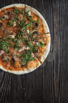 Pizza with chicken mushrooms and rukkola