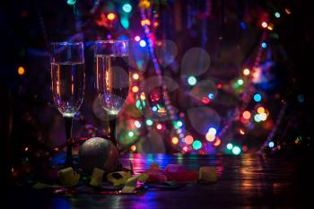 two shampagne glasses on celebratory table