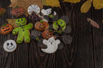 Homemade delicious ginger biscuits for Halloween on wooden table