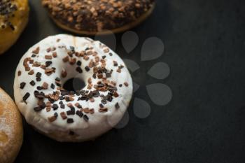 Set of donuts on black background