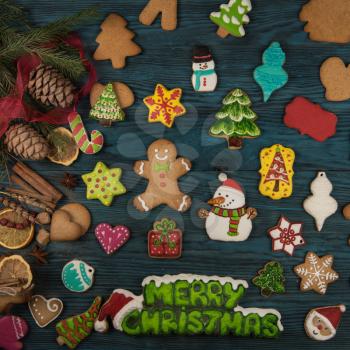 Gingerbreads for new years and christmas on wooden background, xmas theme