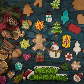 Gingerbreads for new years and christmas on wooden background, xmas theme