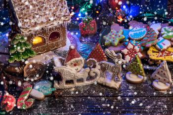 Gingerbreads for new years and christmas on wooden background, xmas theme