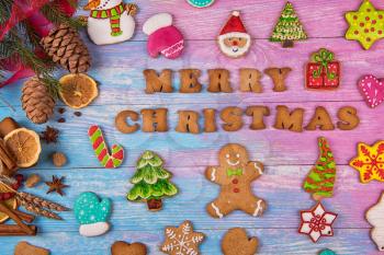 Gingerbreads for new years and christmas on wooden background, xmas theme