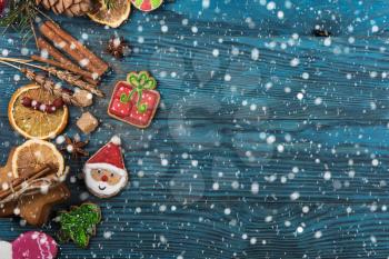 Gingerbreads for new years and christmas on wooden background, xmas theme
