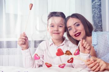 Happy Valentines Day, Mother day or Woman 8 march Day. Young boy spend time with his mum and celebrate it