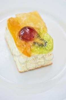 Piece of Fruit cake in a white plate