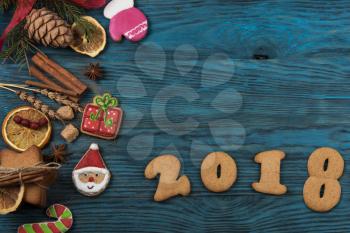 Gingerbreads for new 2017 year on wooden background, xmas theme