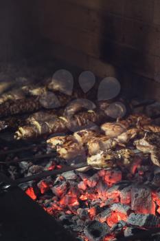 Grilling marinated shashlik on a grill