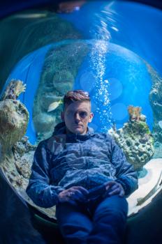 Photo of man in the oceanarium