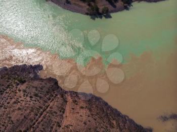 The confluence of two rivers, Katun and Chuya, the famous tourist spot in the Altai mountains, Siberia, Russia, aerial shot.