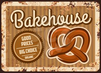 Bakehouse rusty metal plate, vector bakery shop production vintage rust tin sign with fresh pretzel. Bake house products assortment retro poster, pastry and bakery choice ferruginous promo card design