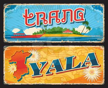 Trang and Yala Thailand provinces tin signs. Thailand territory vintage plate, grunge vector travel sticker or banner with beach seashore and boat, province map silhouette and bullet wood flowers