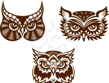 Brown and white wise old owl faces with decorative feather detail for tattoo or mascot design, vector illustration
