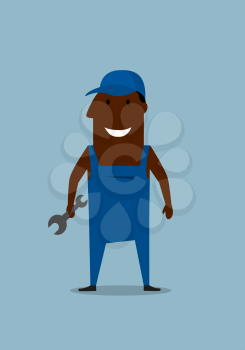 Happy african american smiling mechanic or repairman holding a spanner or wrench