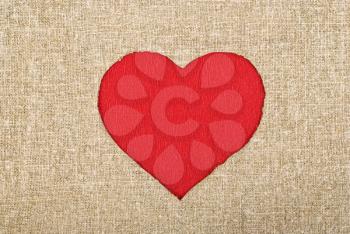 Royalty Free Photo of a Red Heart on a Burlap Sack