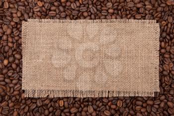 Burlap tag on the background of coffee 