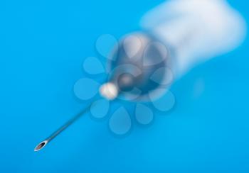 The needle of the syringe. Macro