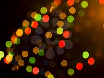 Blurred festive colorful lights over black useful as background