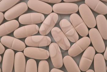 Close-up of Pink pills useful as pharmaceutical background