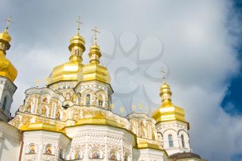 Golden Cupola of Orthodox church and Cloudy sky. Kiev-Pecherskaya Laura.