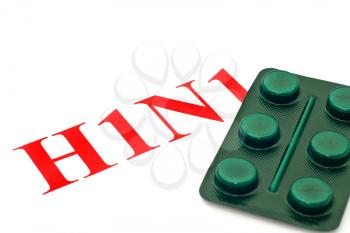 Swine FLU H1N1 - Closeup of green pills on white