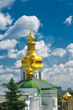 Pecherskaya Laura in Kiev. Cupola of Orthodox church and blue sky with clouds