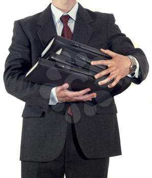 Businessman with stack of folders isolated 