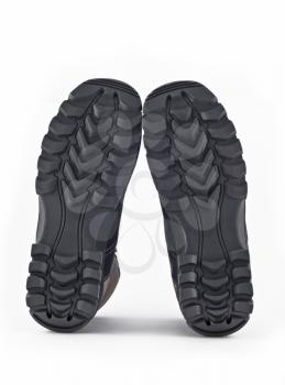 Rubber sole of boots over white background